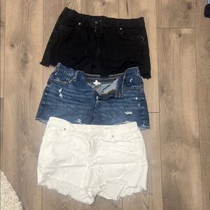 Set of Three Distressed Denim and Black Shorts